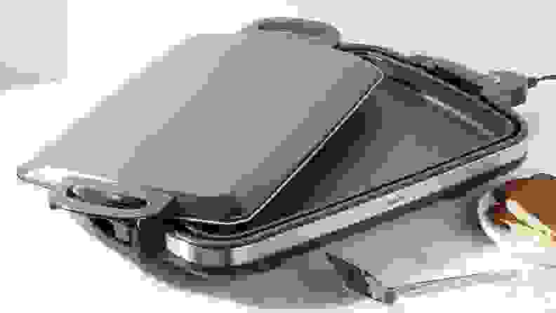 Zojirushi Gourmet Sizzler and lid on white surface