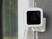 Wyze Cam V3 security camera mounted on wall outdoors.